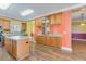Bright eat-in kitchen with hardwood floors and an island great for food prep and entertaining at 1677 French Santee Rd, Jamestown, SC 29453