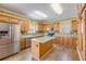 Traditional kitchen with wood cabinets, stainless appliances and colorful tile backsplash at 1677 French Santee Rd, Jamestown, SC 29453