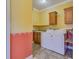 Functional laundry room features ample cabinet space and modern washer and dryer units at 1677 French Santee Rd, Jamestown, SC 29453
