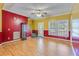 Spacious living room with hardwood floors, large windows, and a welcoming entrance at 1677 French Santee Rd, Jamestown, SC 29453