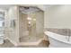 Luxury bathroom featuring a glass shower, soaking tub, tile, and modern fixtures at 1723 River Front Dr, Charleston, SC 29407