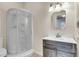 Bathroom featuring a curved glass shower, modern vanity, decorative mirror, and a toilet at 1723 River Front Dr, Charleston, SC 29407