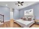 Spacious bedroom with wood floors, ceiling fan, and bright windows offering natural light at 1723 River Front Dr, Charleston, SC 29407