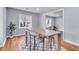 Open concept dining room with wood floors, lots of light, and seating for four at 1723 River Front Dr, Charleston, SC 29407