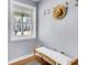 Cozy entryway features a bench, hat rack, and window overlooking the front yard at 1723 River Front Dr, Charleston, SC 29407