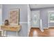 Stylish entryway with console table and decorative mirror, leading to the main living area at 1723 River Front Dr, Charleston, SC 29407