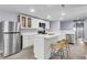 Well-lit kitchen featuring stainless steel appliances and a center island with bar seating at 1723 River Front Dr, Charleston, SC 29407