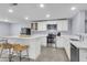 Bright kitchen with stainless steel appliances, white cabinetry and a center island at 1723 River Front Dr, Charleston, SC 29407