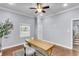 Bright office space with wood floors, large window, and a modern wood desk at 1723 River Front Dr, Charleston, SC 29407
