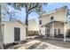 Spacious backyard features a screened-in porch, storage shed, and mature trees, creating a private outdoor retreat at 1782 Towne St, Johns Island, SC 29455