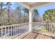 Charming balcony with wooden floor and white railing overlooks scenic neighborhood views at 1782 Towne St, Johns Island, SC 29455