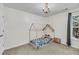 Bright bedroom with a house frame style bed and a classic chandelier at 1782 Towne St, Johns Island, SC 29455