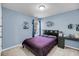 Cozy bedroom with blue walls, decorative wall art, and a comfortable-looking bed at 1782 Towne St, Johns Island, SC 29455
