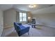 Bright bonus room with neutral walls, comfortable seating, and a window for natural light at 1782 Towne St, Johns Island, SC 29455