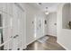 Spacious foyer boasting hardwood floors, an archway, and stylish decor, creating a welcoming entrance to the home at 1782 Towne St, Johns Island, SC 29455
