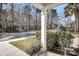 Front porch view of street with sidewalk and trees along with landscape and bench on the porch at 1782 Towne St, Johns Island, SC 29455