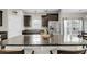 Bright kitchen with granite countertops, stainless steel refrigerator, and stylish pendant lighting at 1782 Towne St, Johns Island, SC 29455