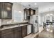 Modern kitchen featuring stainless steel appliances and dark wood cabinets at 1782 Towne St, Johns Island, SC 29455