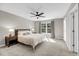 Serene main bedroom with a ceiling fan, large window, and neutral decor at 1782 Towne St, Johns Island, SC 29455