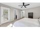 Bright main bedroom featuring a ceiling fan, outdoor access, and closet entrance at 1782 Towne St, Johns Island, SC 29455