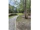 Community area featuring a pond, crushed gravel walking trail, and surrounding wooded landscape at 1782 Towne St, Johns Island, SC 29455