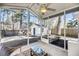 Relaxing screened porch with ceiling fan and view of backyard shed and landscaping at 1782 Towne St, Johns Island, SC 29455