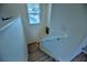 Carpeted stairway with white railings, leading to the upper level of the home at 1782 Towne St, Johns Island, SC 29455