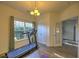 Bright room with a treadmill and large window, complete with a closet and French doors, ready for a home gym setup at 1782 Towne St, Johns Island, SC 29455