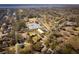 An aerial view showing a school and neighborhood surrounded by mature trees in a community near the water at 1981 Central Park Rd, Charleston, SC 29412
