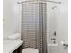 Bathroom featuring shower-tub combo, white vanity, and decorative accents at 1981 Central Park Rd, Charleston, SC 29412