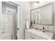 Bathroom featuring shower and tub combination, vanity with marble top and large mirror at 1981 Central Park Rd, Charleston, SC 29412