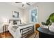 Cozy bedroom with a ceiling fan, window, and a desk area at 1981 Central Park Rd, Charleston, SC 29412