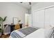 Comfortable bedroom with a modern ceiling fan, closet and a desk area at 1981 Central Park Rd, Charleston, SC 29412