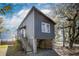Two-story modern home featuring a raised foundation and a vertical plank design for a contemporary look at 1981 Central Park Rd, Charleston, SC 29412
