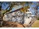 Charming home exterior featuring multiple porches, siding, and large trees at 1981 Central Park Rd, Charleston, SC 29412
