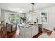 Open concept kitchen and living room with a view to the outdoor covered balcony at 1981 Central Park Rd, Charleston, SC 29412