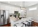 Bright kitchen with a granite island, stainless steel appliances, and modern lighting at 1981 Central Park Rd, Charleston, SC 29412