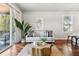 Bright and open living room featuring stylish furnishings and sliding doors to the covered balcony at 1981 Central Park Rd, Charleston, SC 29412
