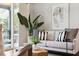 Comfortable living room with contemporary decor, sliding glass doors to the balcony, and ample natural light at 1981 Central Park Rd, Charleston, SC 29412