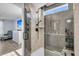Stunning walk-in shower with sleek fixtures, glass door, and neutral tile at 201 Garden Lily Lane, Summerville, SC 29485