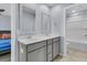 Bright bathroom featuring double sinks and a shower-tub combo at 201 Garden Lily Lane, Summerville, SC 29485