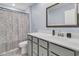 Bathroom with a dark vanity and a shower with patterned curtain at 201 Garden Lily Lane, Summerville, SC 29485