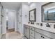 Bathroom featuring a double sink vanity, framed mirrors, and access to the shower at 201 Garden Lily Lane, Summerville, SC 29485