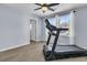 Spare bedroom featuring a black treadmill, light-colored walls, and a window at 201 Garden Lily Lane, Summerville, SC 29485