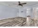 Bonus room features neutral paint, ceiling fan, and wood-look floors at 201 Garden Lily Lane, Summerville, SC 29485