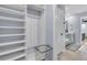 Hallway with white trim, blue walls, and access to a bathroom and other rooms at 201 Garden Lily Lane, Summerville, SC 29485