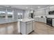 Modern kitchen boasts quartz countertops, ample cabinet space and stainless steel appliances at 201 Garden Lily Lane, Summerville, SC 29485