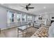 Spacious living room featuring neutral furniture, plenty of natural light and an open floor plan at 201 Garden Lily Lane, Summerville, SC 29485