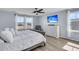 Bright main bedroom with ample natural light, ceiling fan, and a neutral color palette at 201 Garden Lily Lane, Summerville, SC 29485