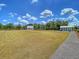 Expansive green common area with manicured grass and several buildings accessible by a gravel walking path at 201 Garden Lily Lane, Summerville, SC 29485
